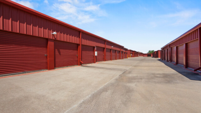 aisle of drive-up storage units at Storage Depot in Flower Mound, TX